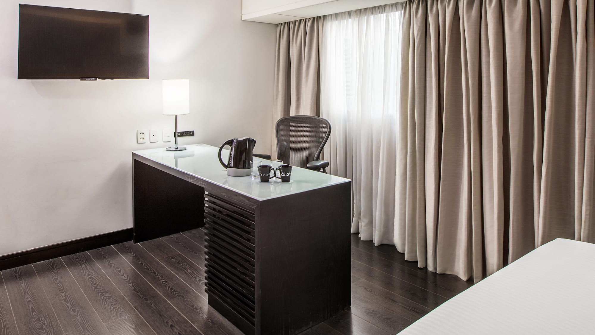 a desk in a hotel room