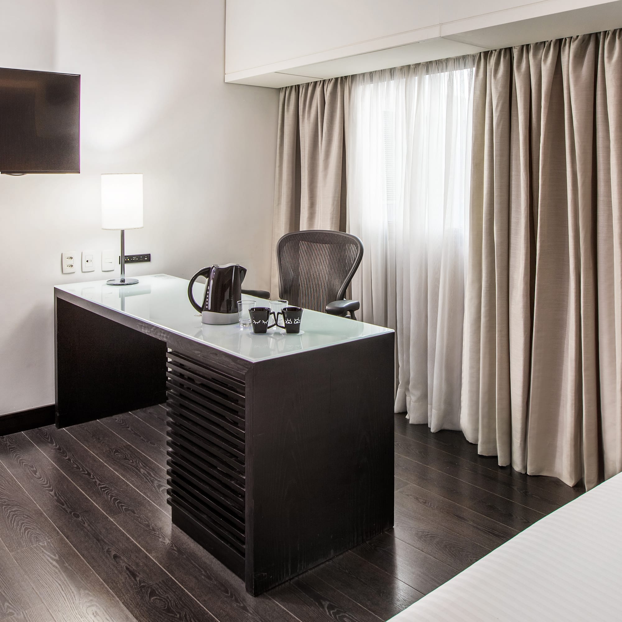 a desk in a hotel room