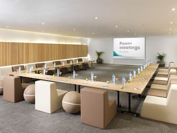 a conference room with a large table and chairs