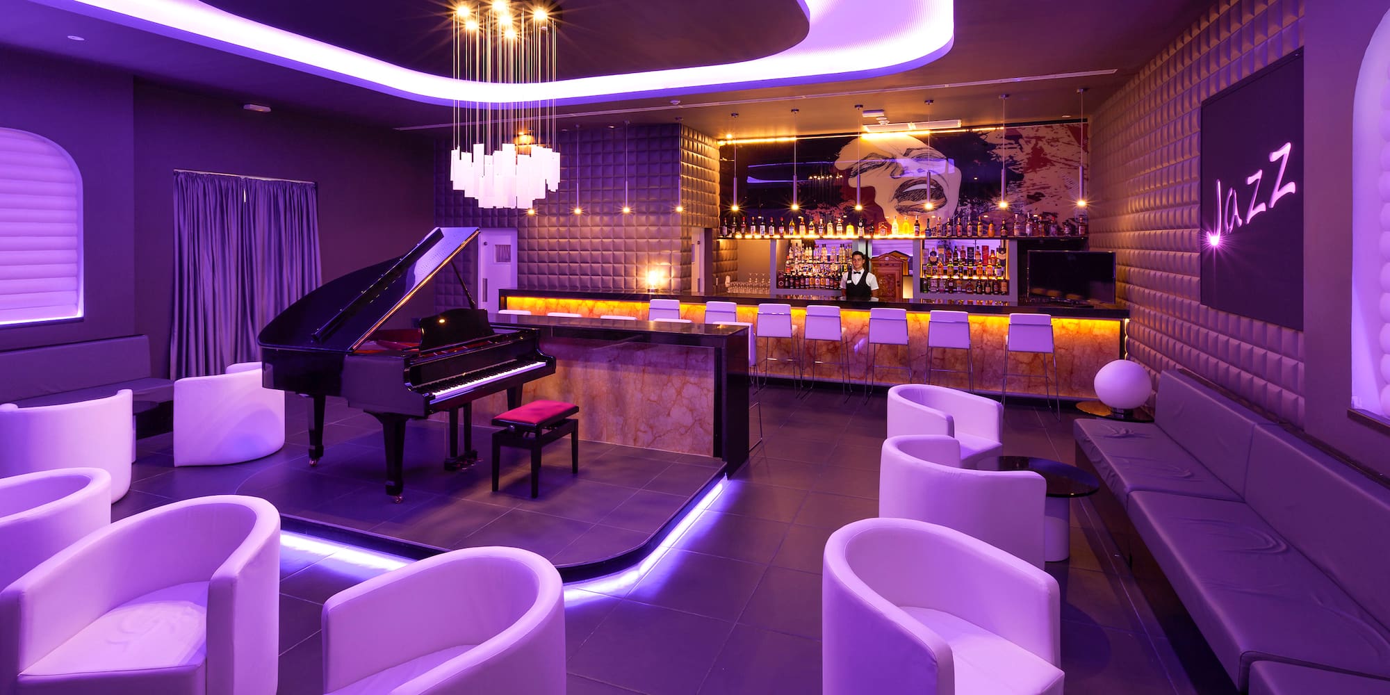 a room with a piano and chairs