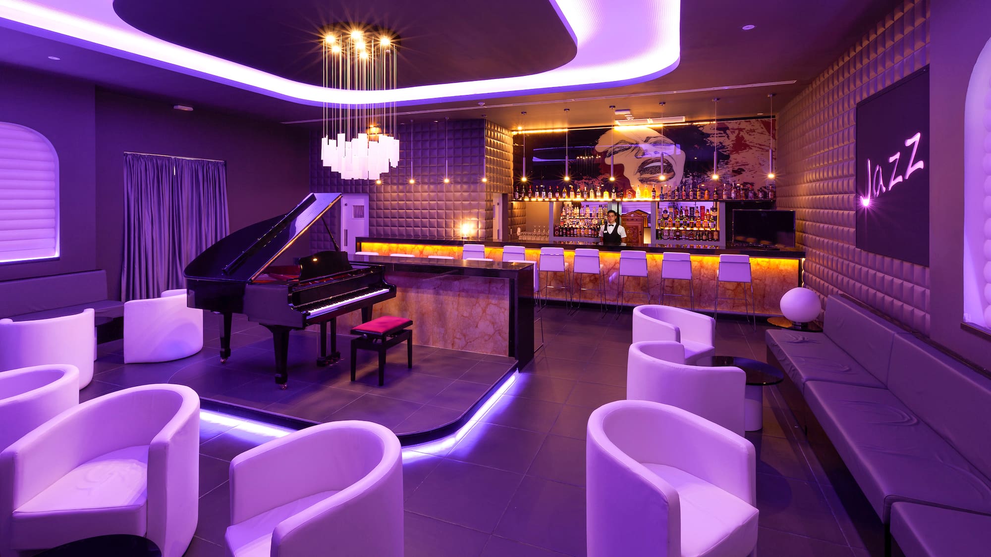 a room with a piano and chairs