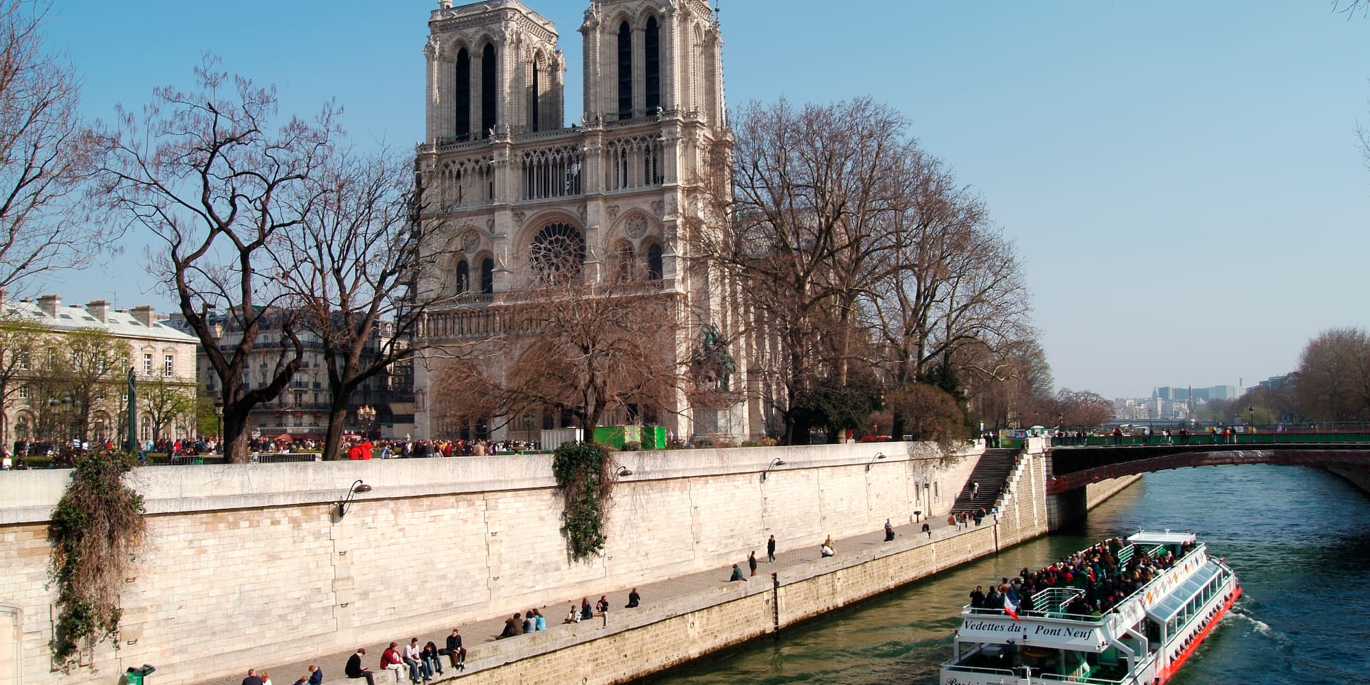 a boat on a river with people on it