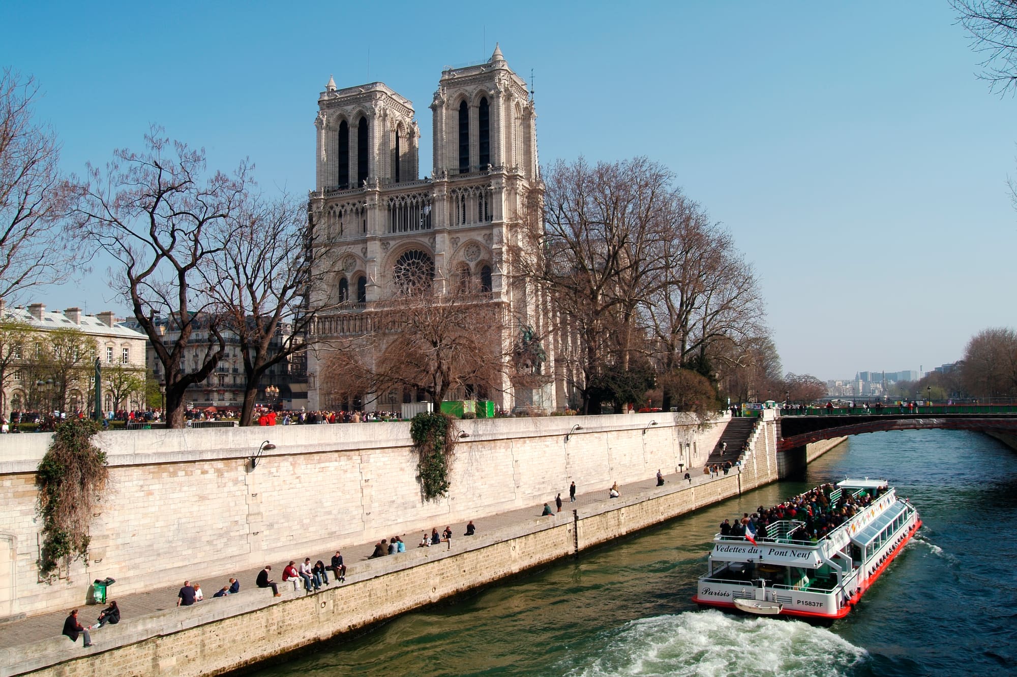 a boat on a river with people on it