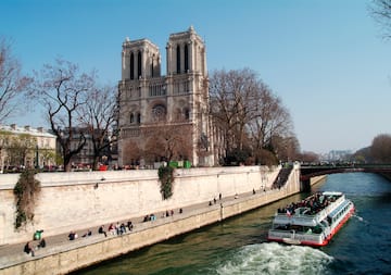 a boat on a river with people on it