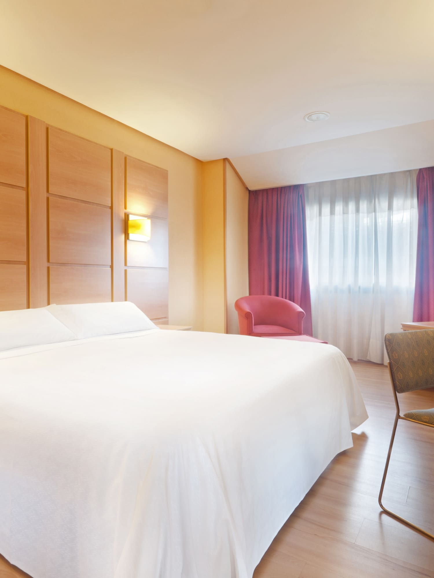 a room with a bed and a desk