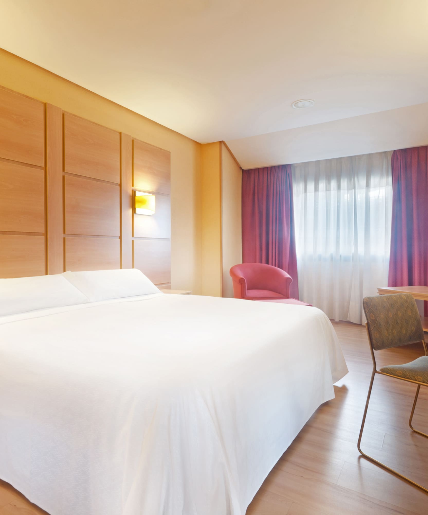 a room with a bed and a desk