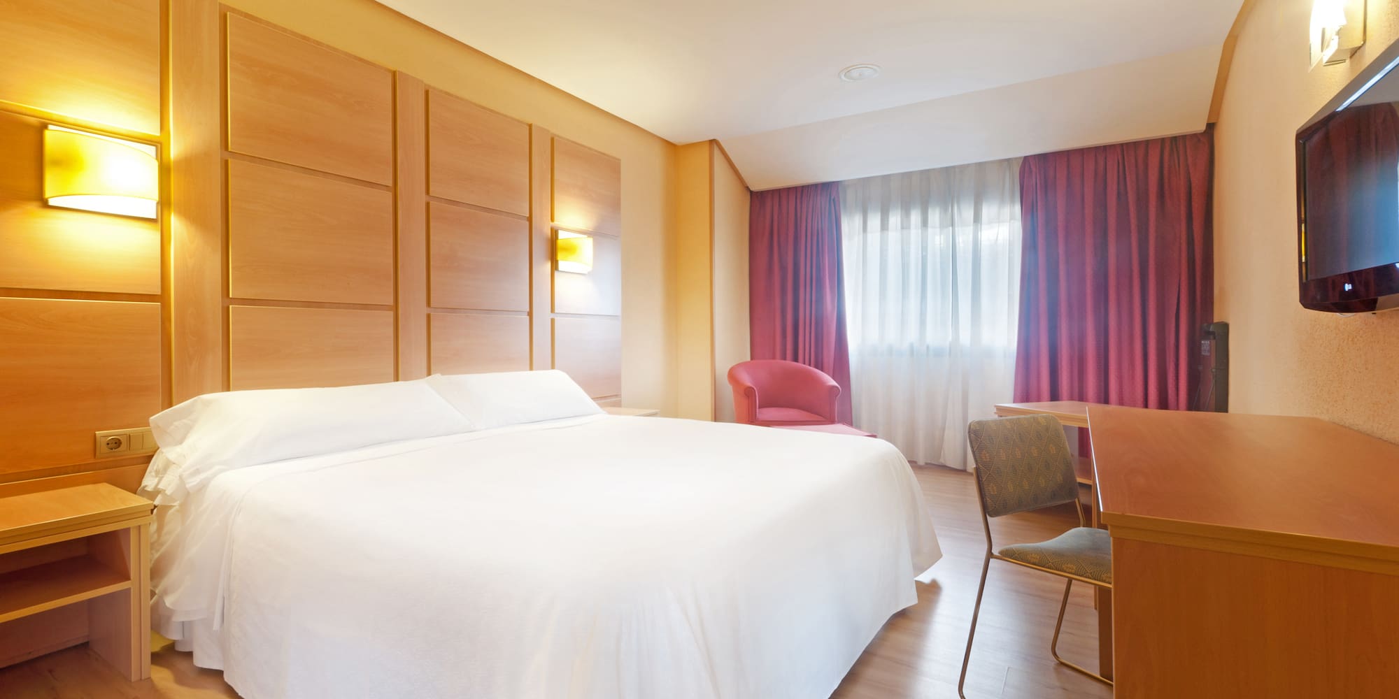 a room with a bed and a desk