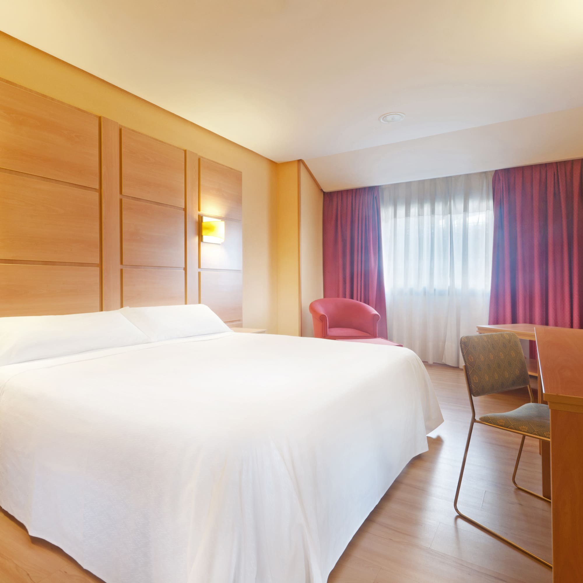 a room with a bed and a desk