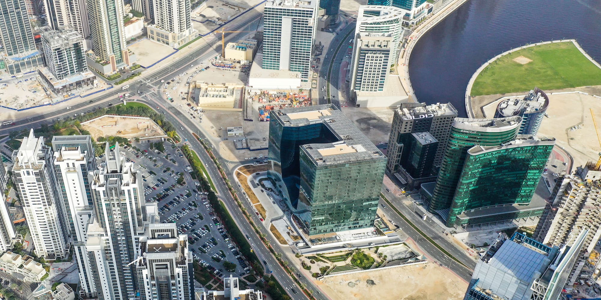 a city with many tall buildings and a river