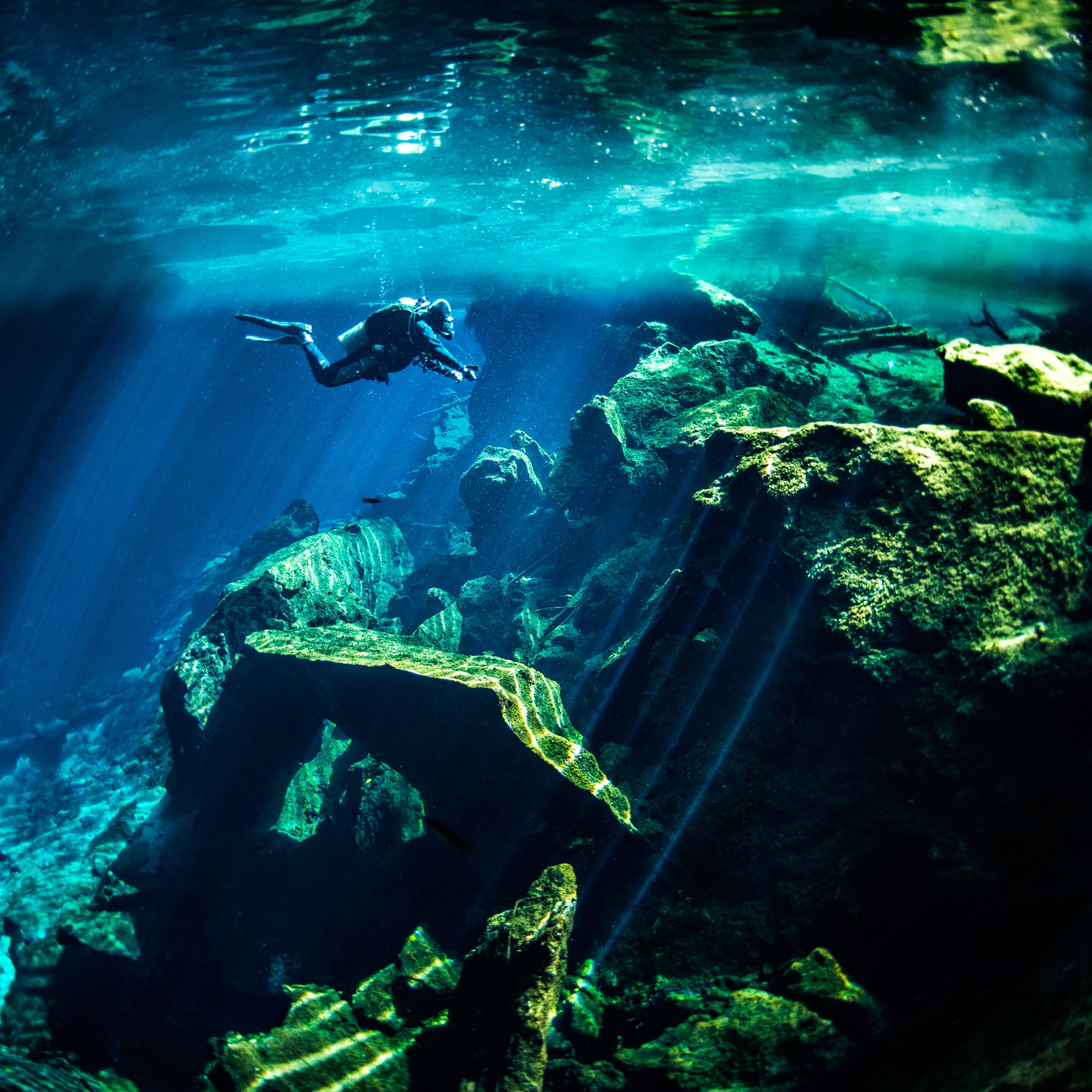 a person swimming under water