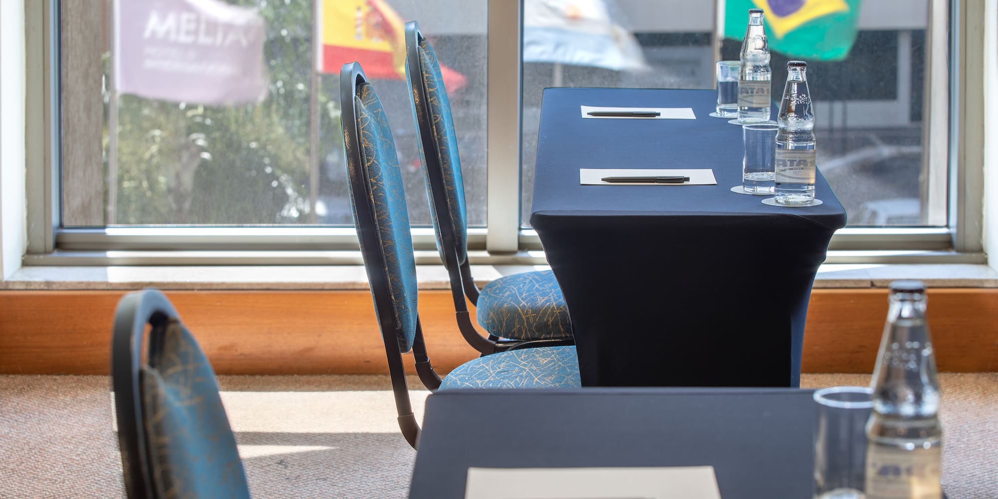 a table with a few bottles of water on it