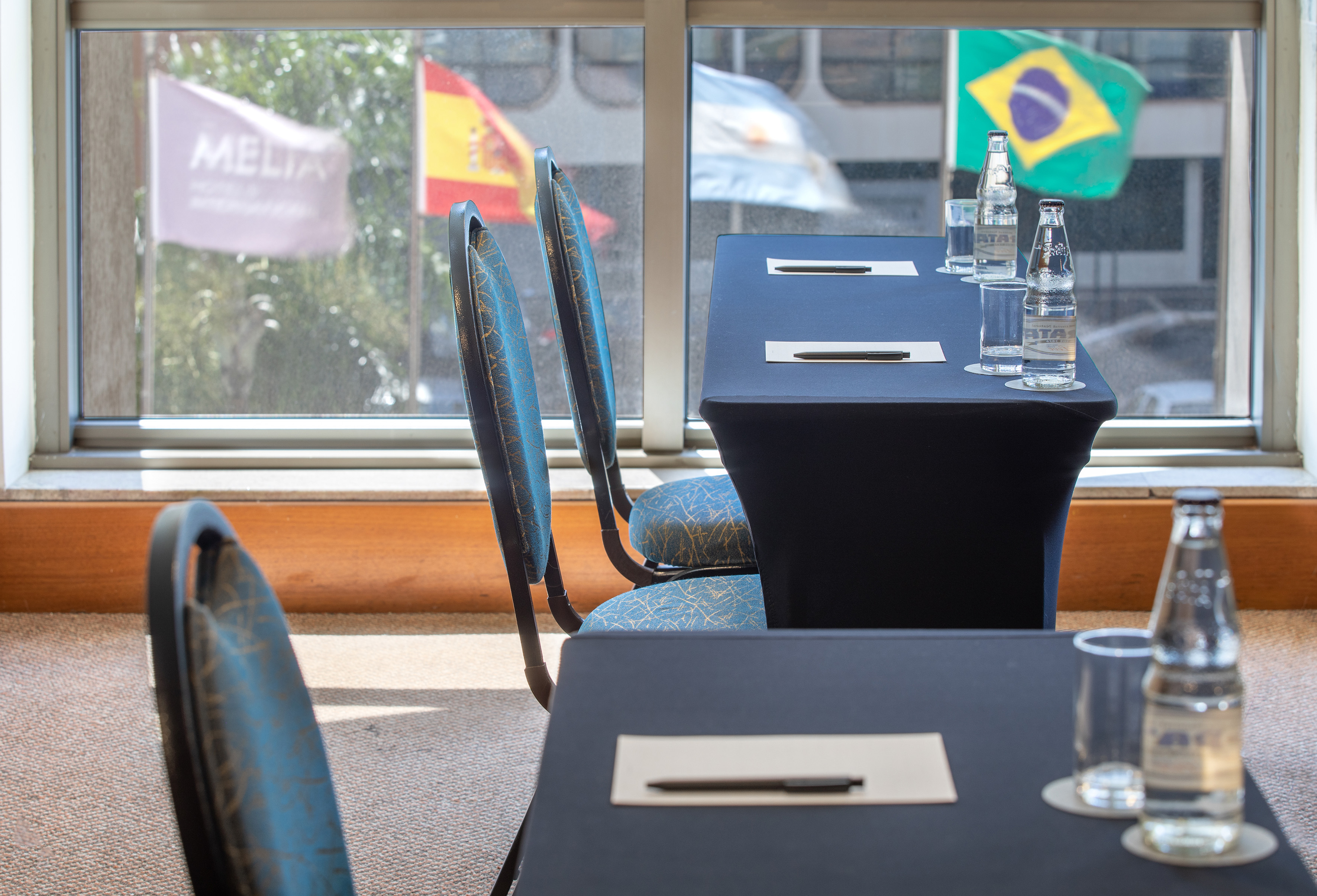 a table with a few bottles of water on it
