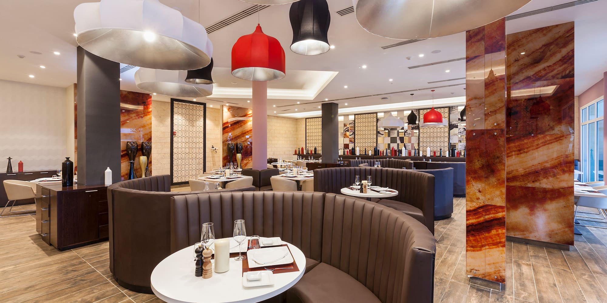 a restaurant with round tables and chairs