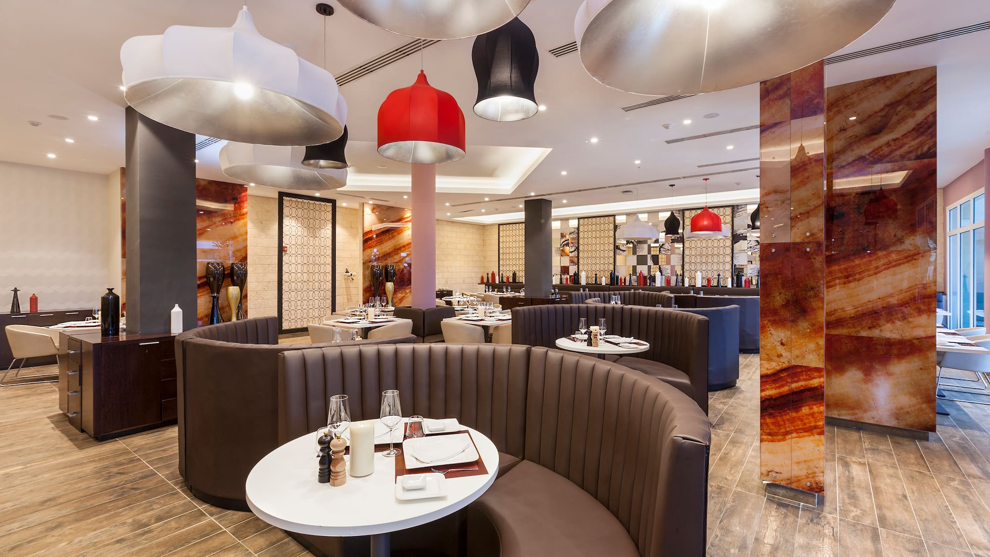 a restaurant with round tables and chairs