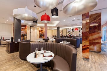 a restaurant with round tables and chairs