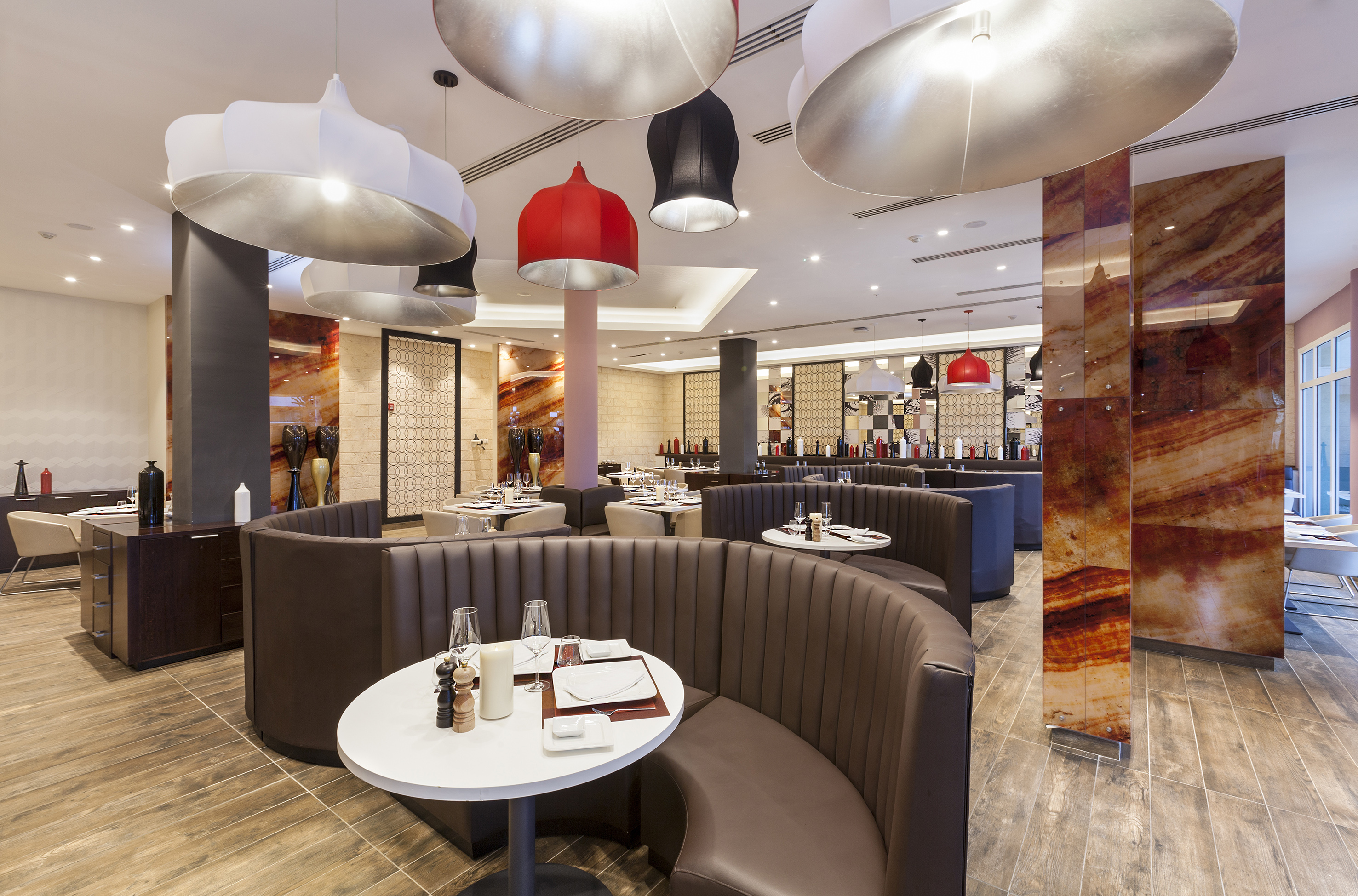 a restaurant with round tables and chairs