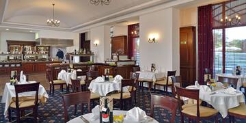 a restaurant with tables and chairs