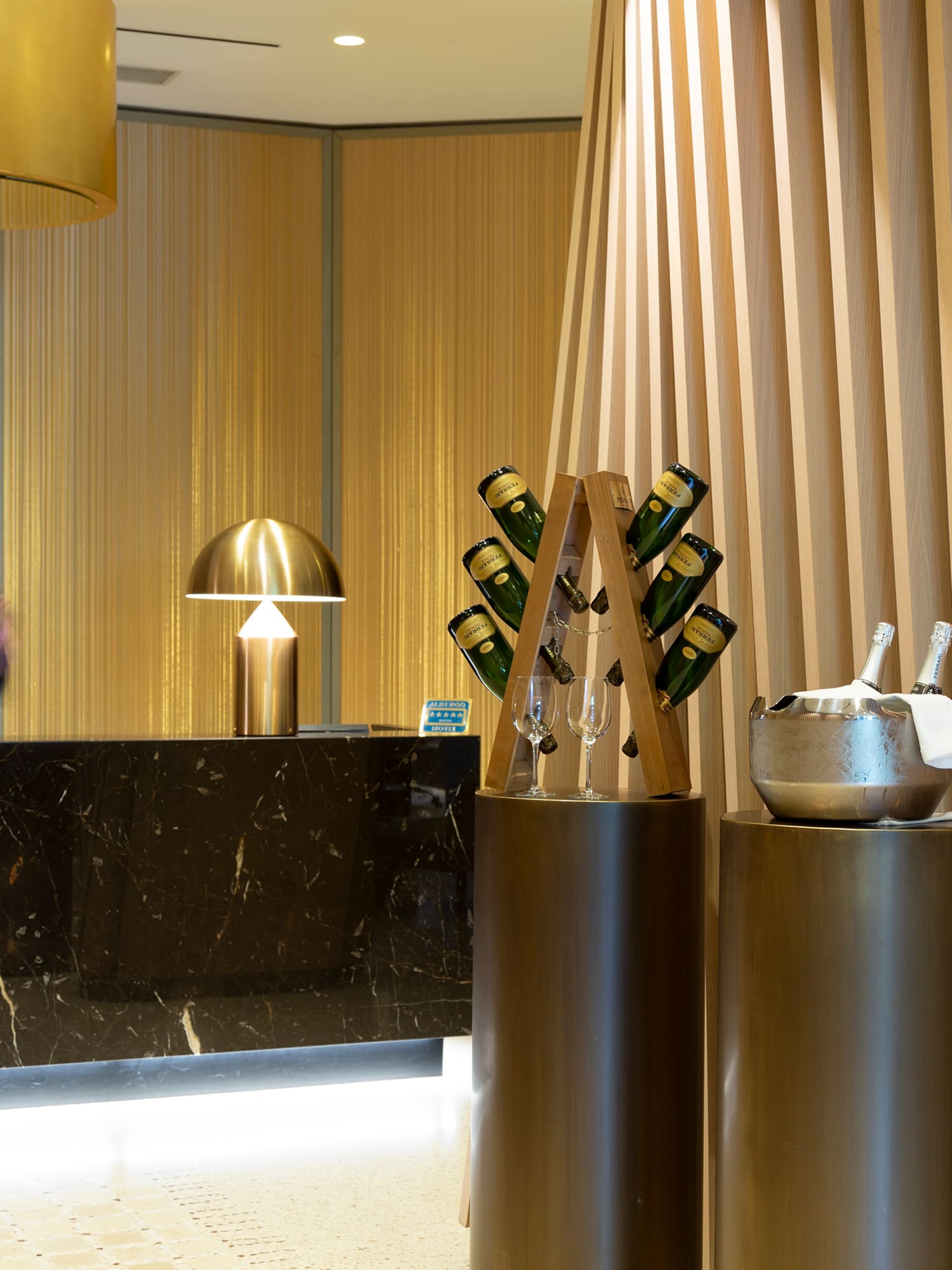 a counter with a group of wine glasses