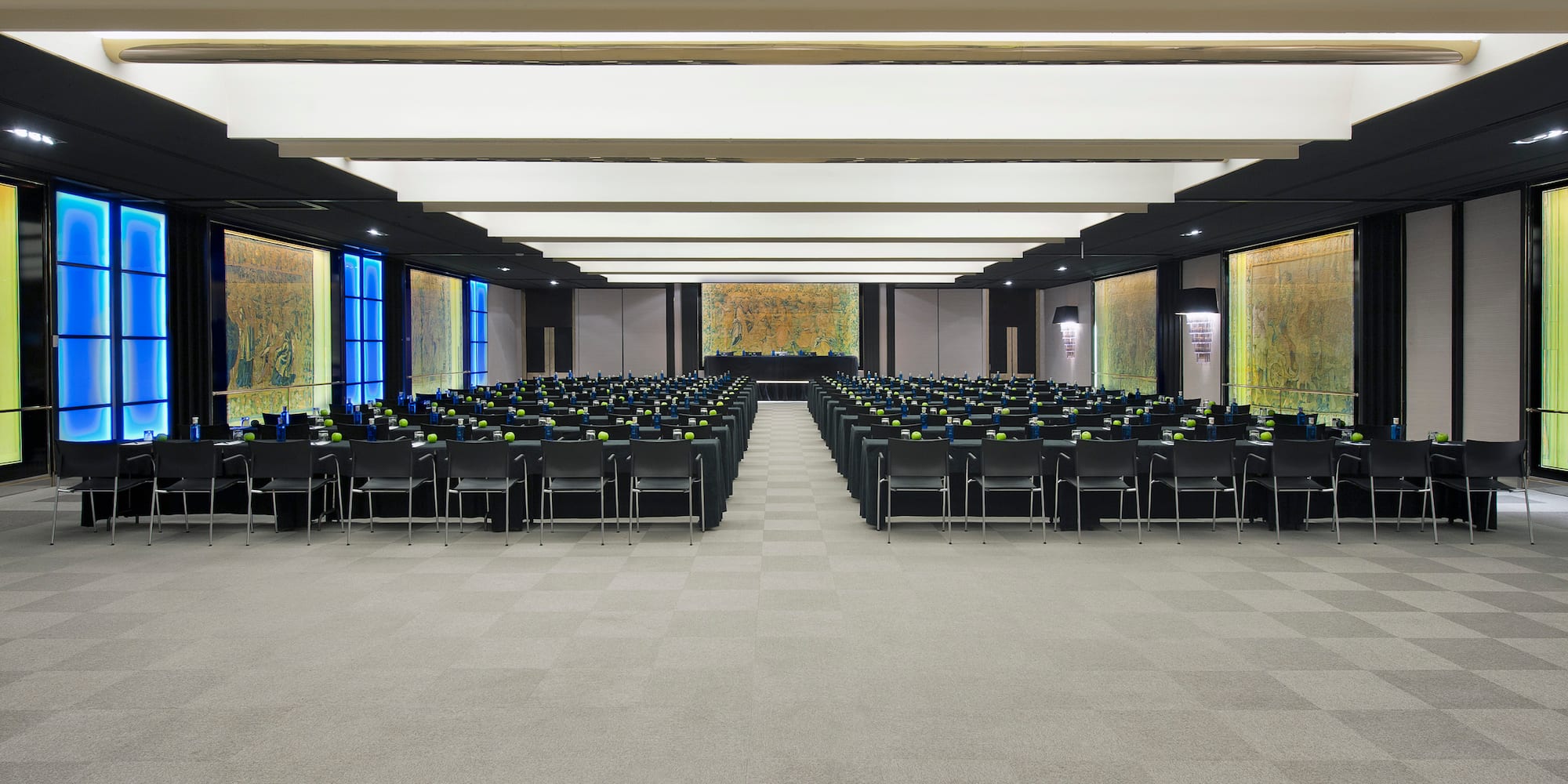 a room with many chairs and tables