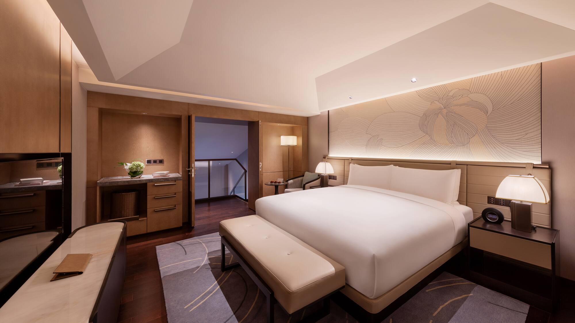 a room with a bed and a bench