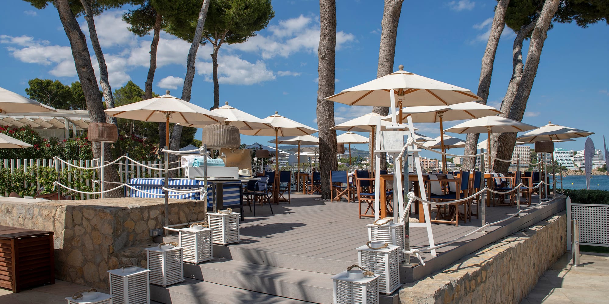 a patio with umbrellas and chairs