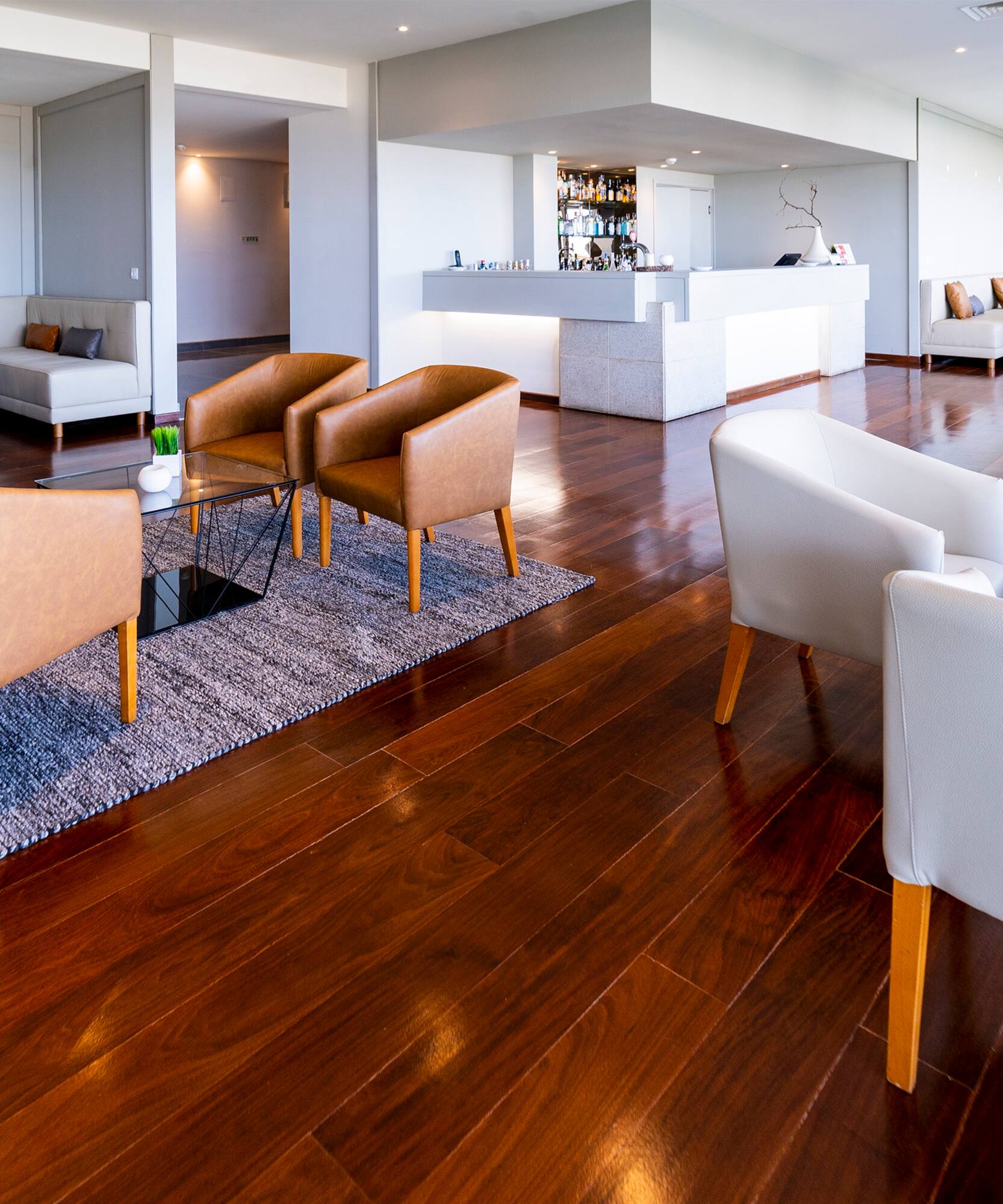 a room with a reception desk and chairs