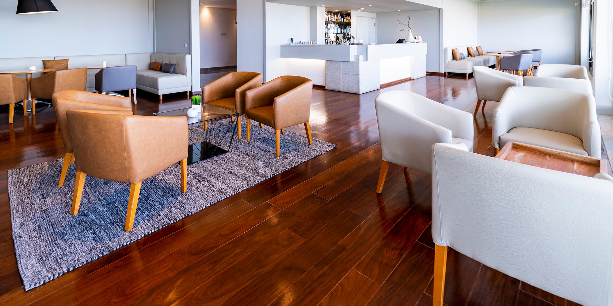a room with a reception desk and chairs