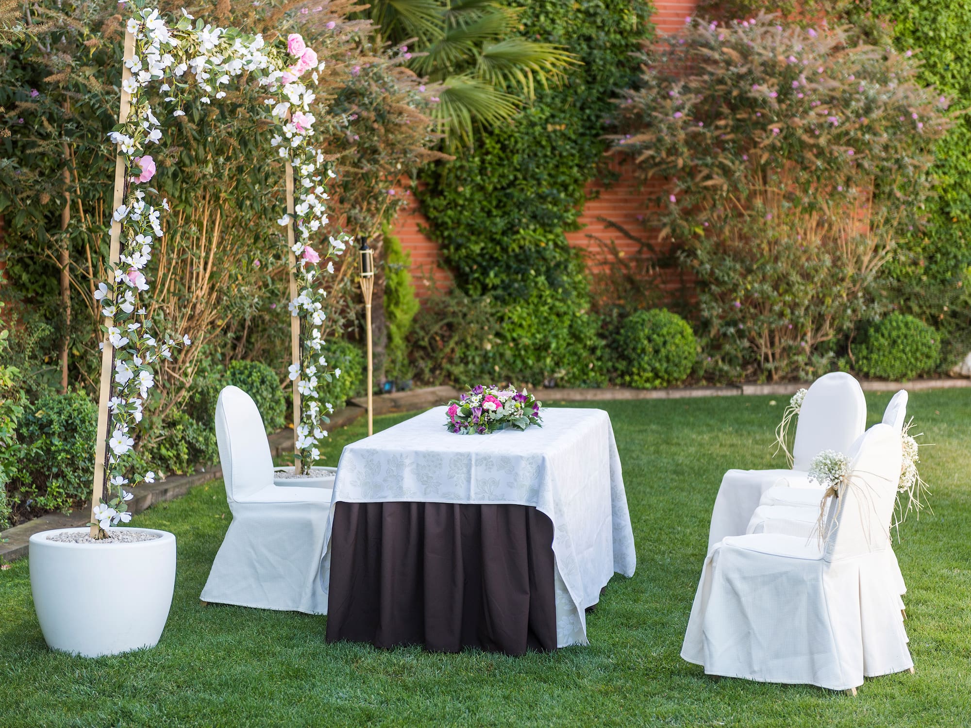 a table and chairs in a yard