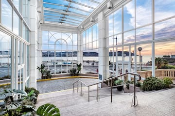 a glass building with stairs and railings