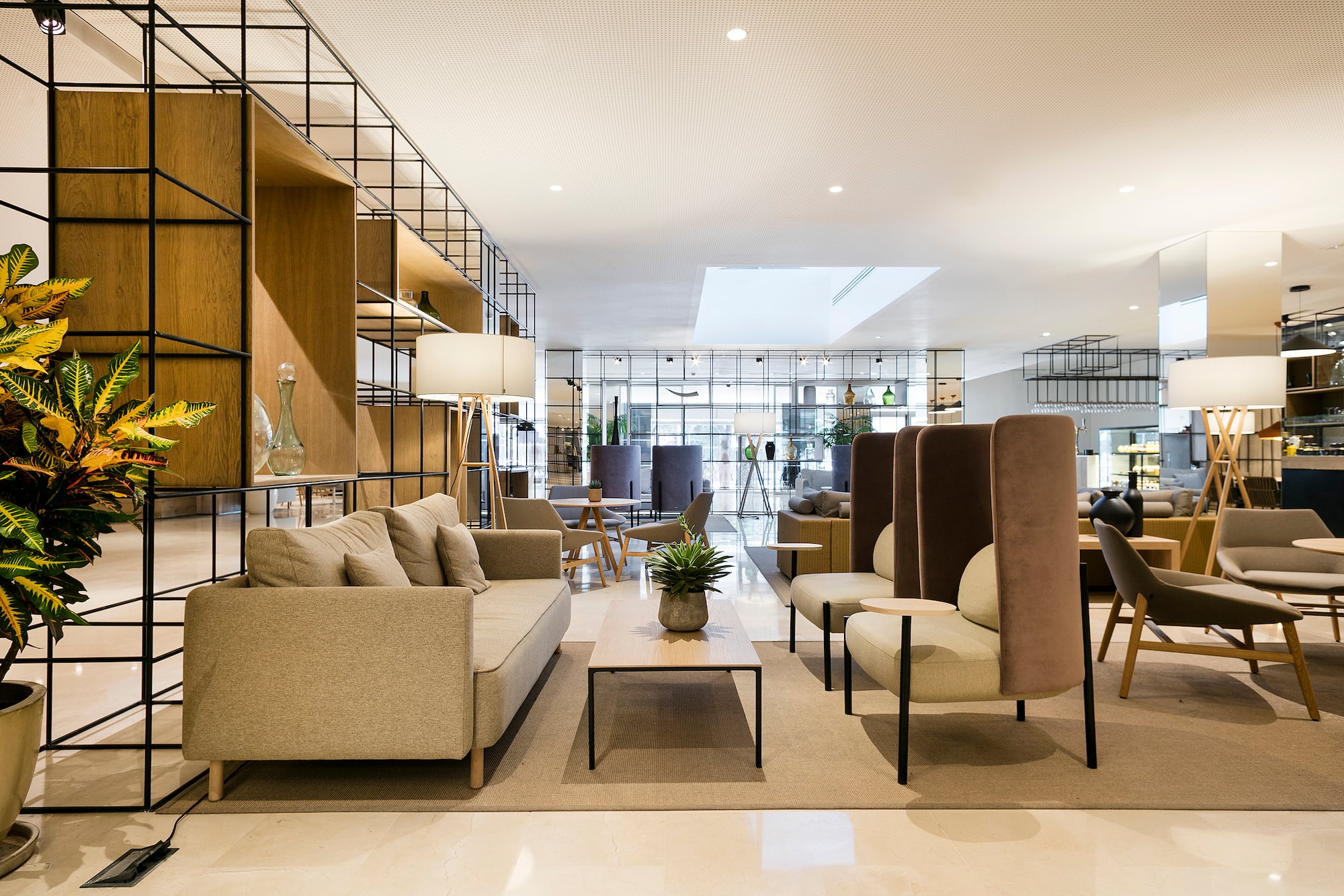 a room with a couch and chairs