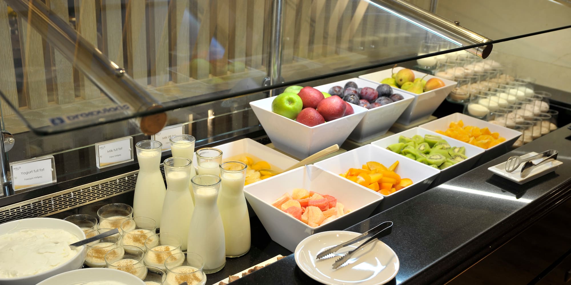 a buffet with fruit and yogurt
