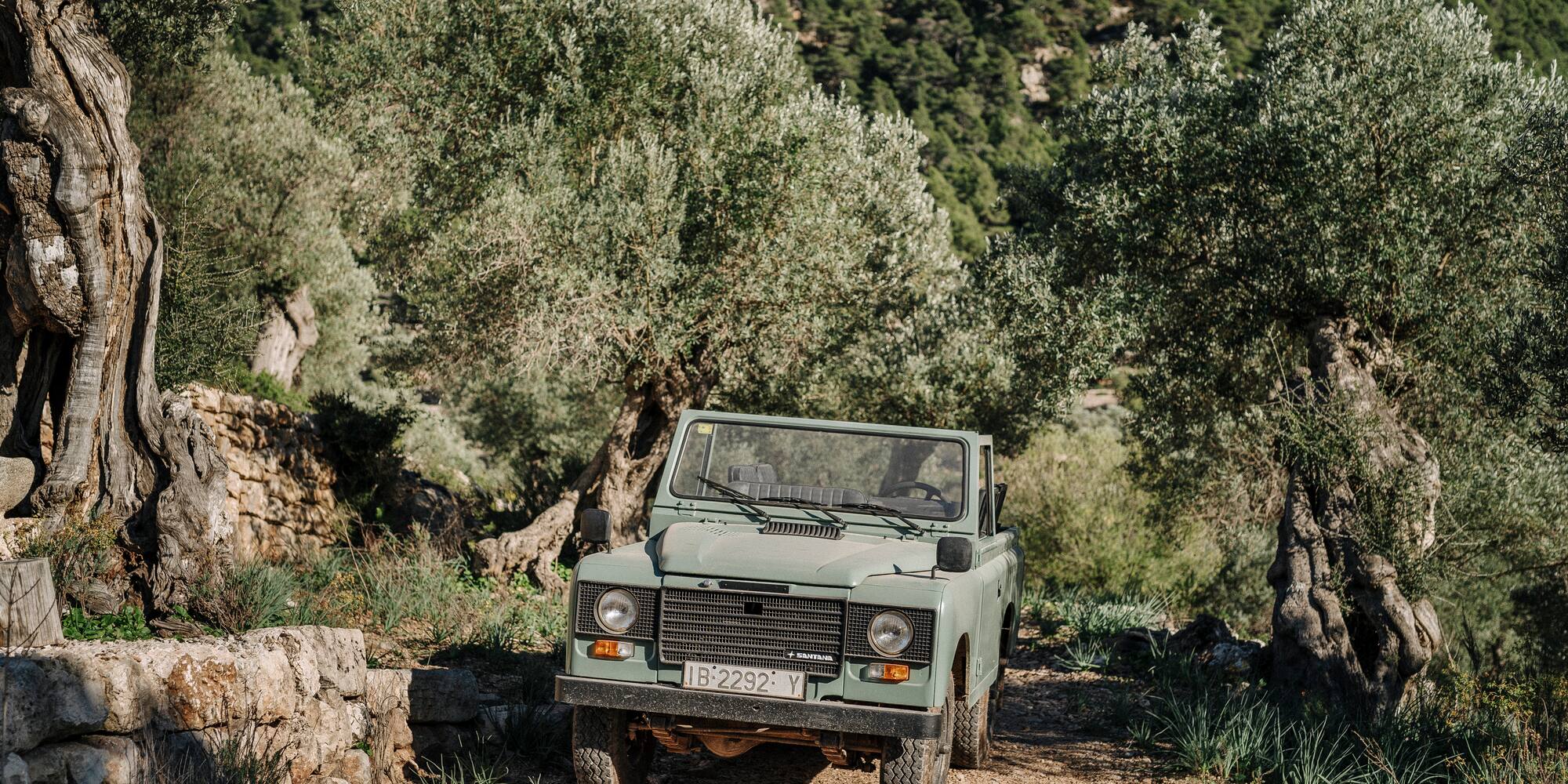 a car parked on a dirt road