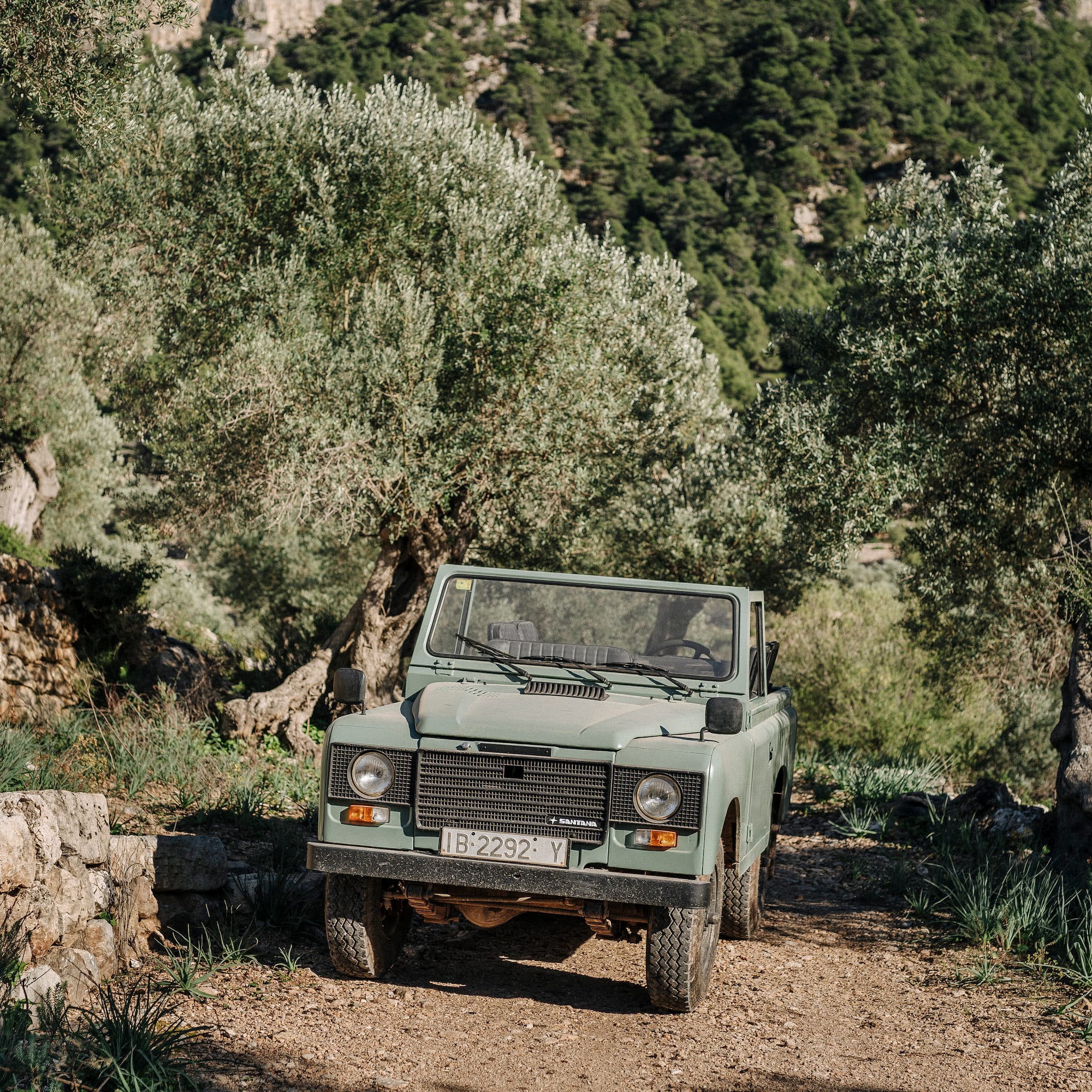 a car parked on a dirt road