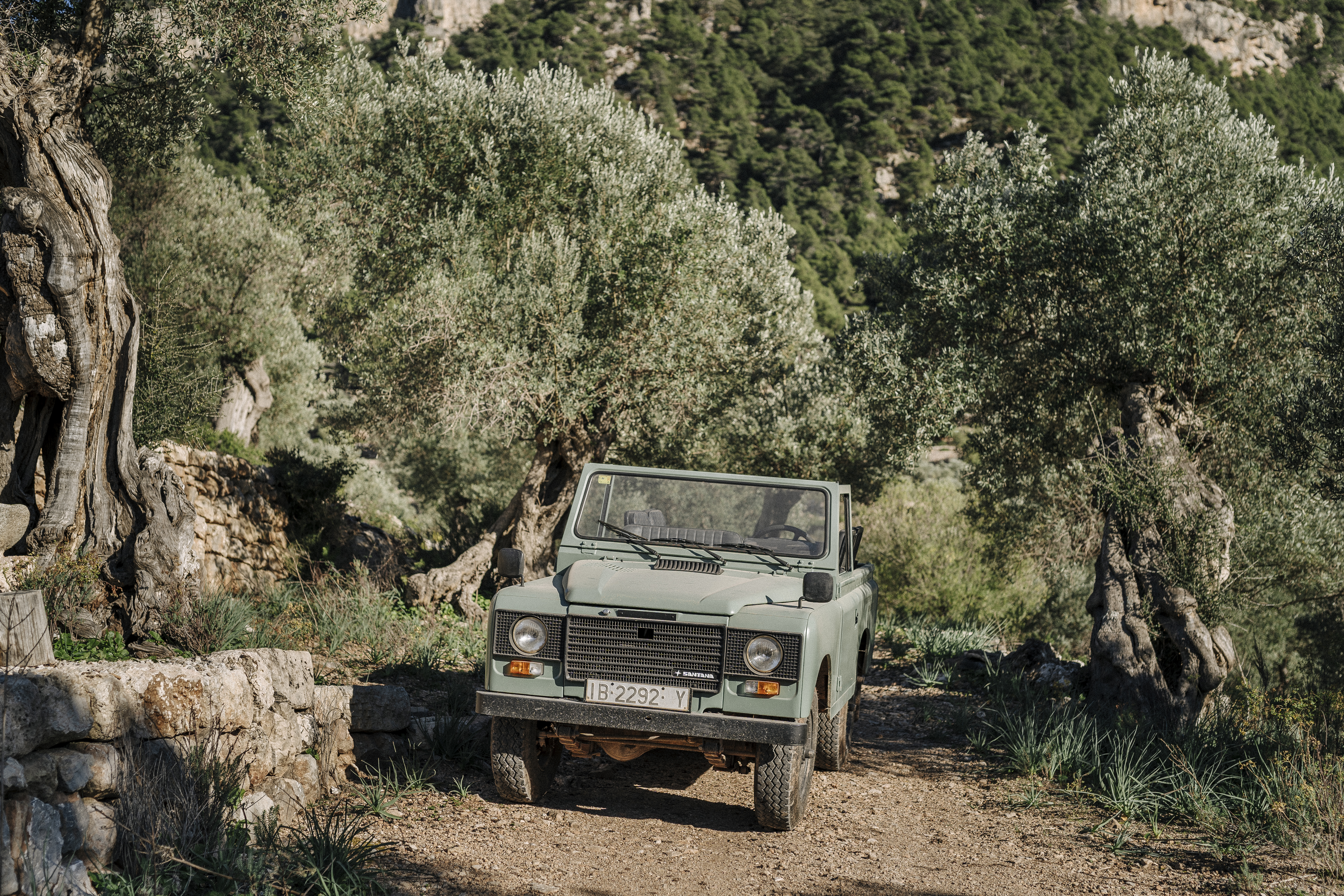 a car parked on a dirt road