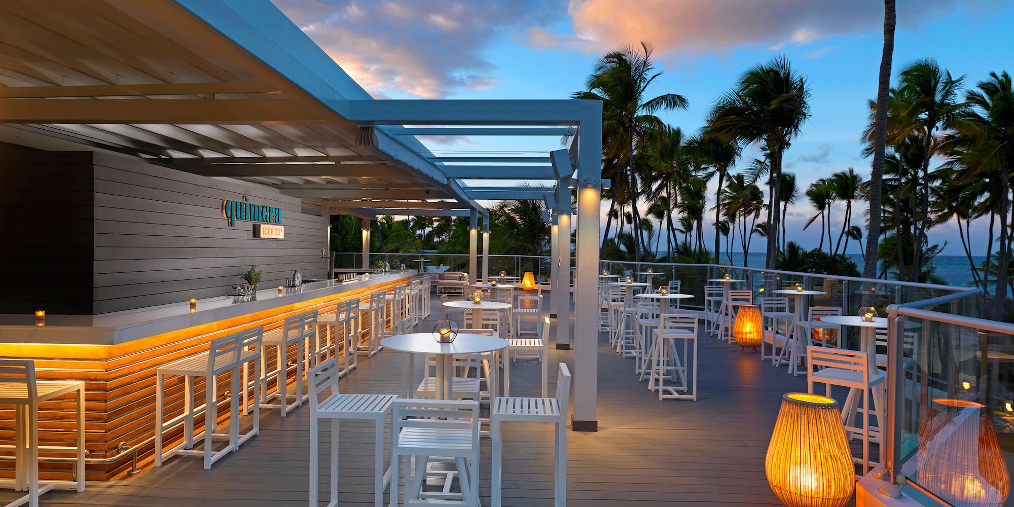 a restaurant with tables and chairs on a deck