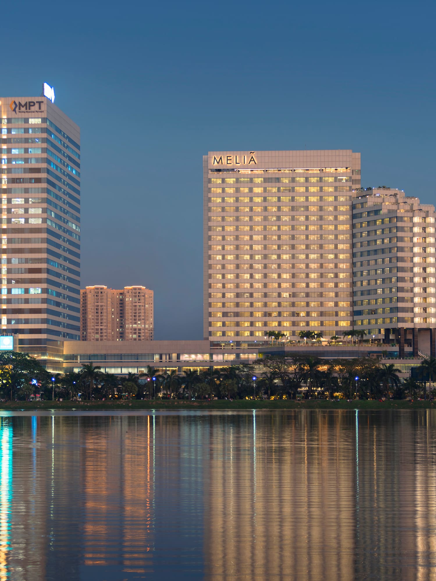 a group of buildings next to a body of water