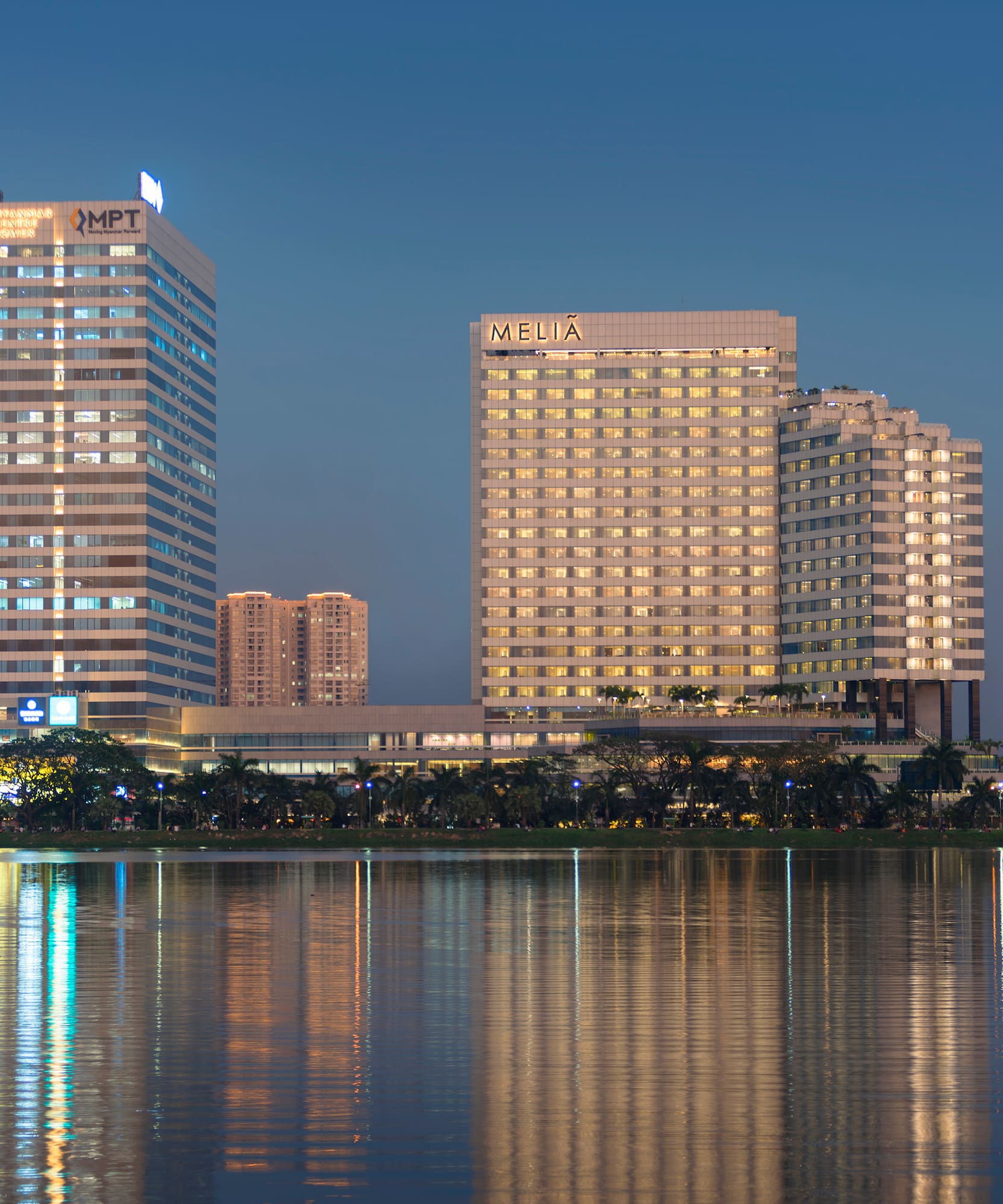 a group of buildings next to a body of water