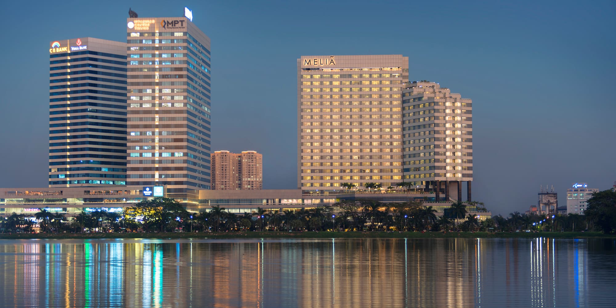a group of buildings next to a body of water