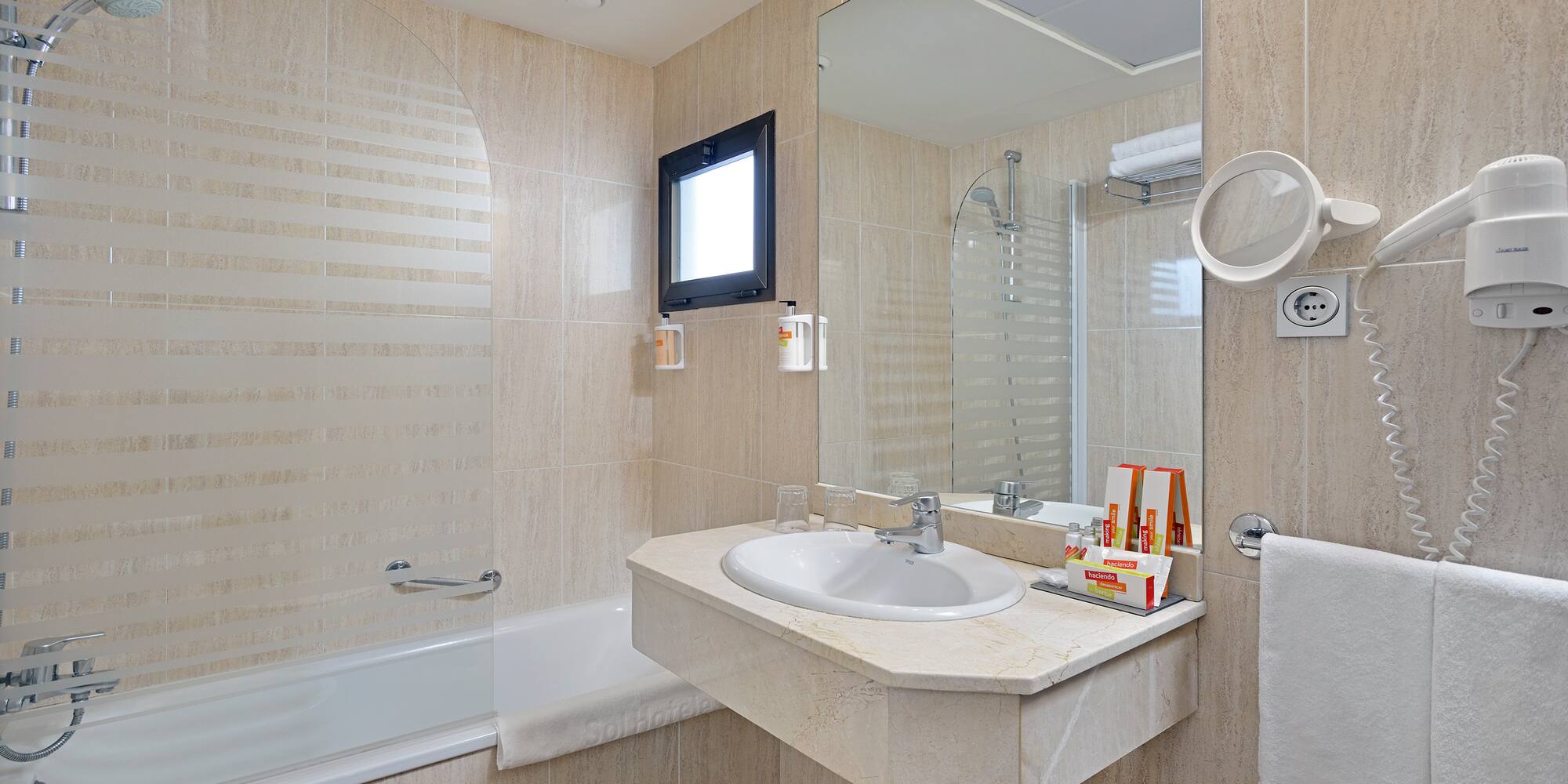 a bathroom with a sink and shower