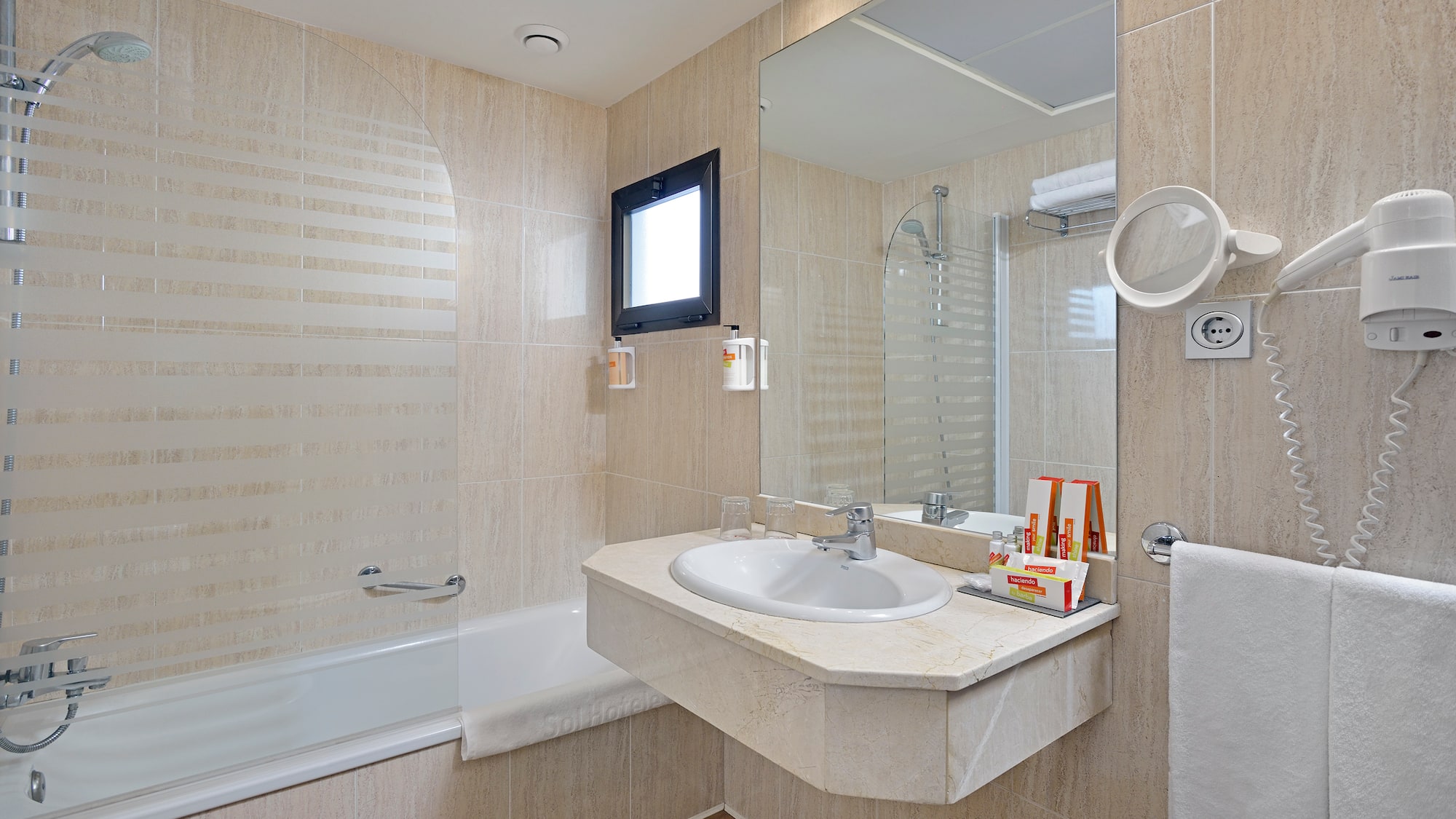 a bathroom with a sink and shower