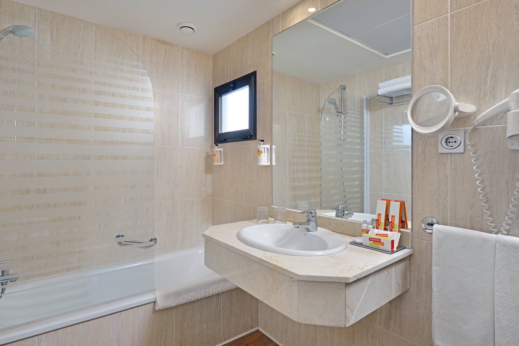 a bathroom with a sink and shower