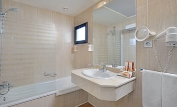 a bathroom with a sink and shower