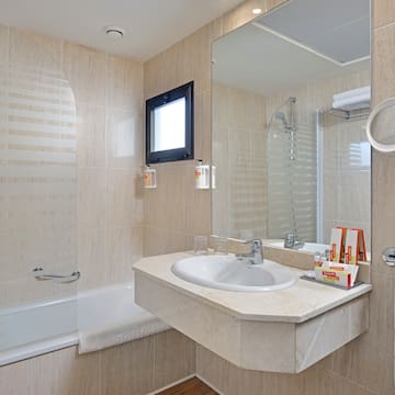 a bathroom with a sink and shower
