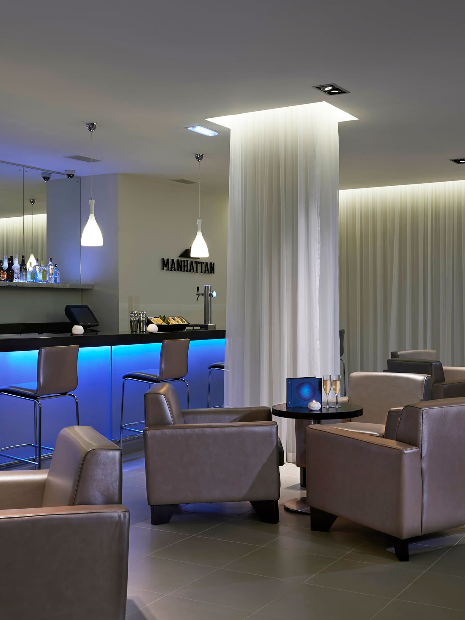 a room with chairs and a bar