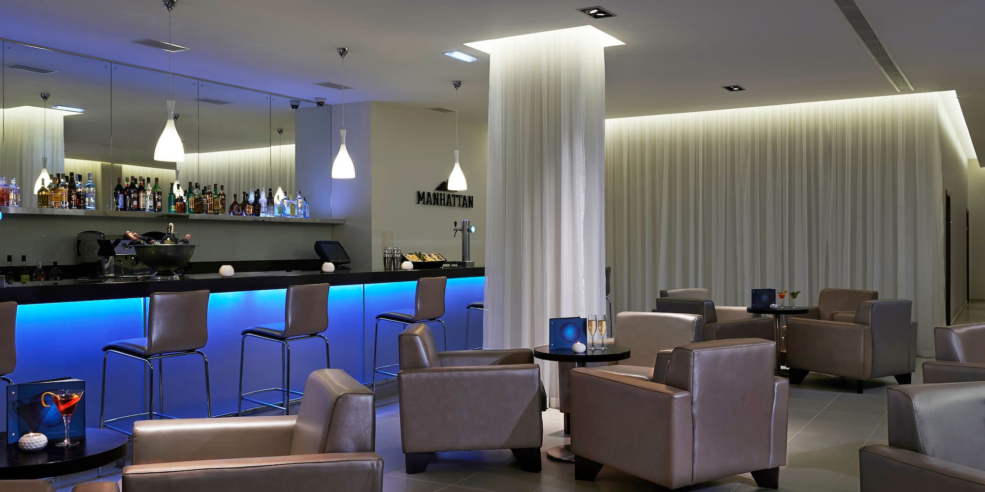 a room with chairs and a bar