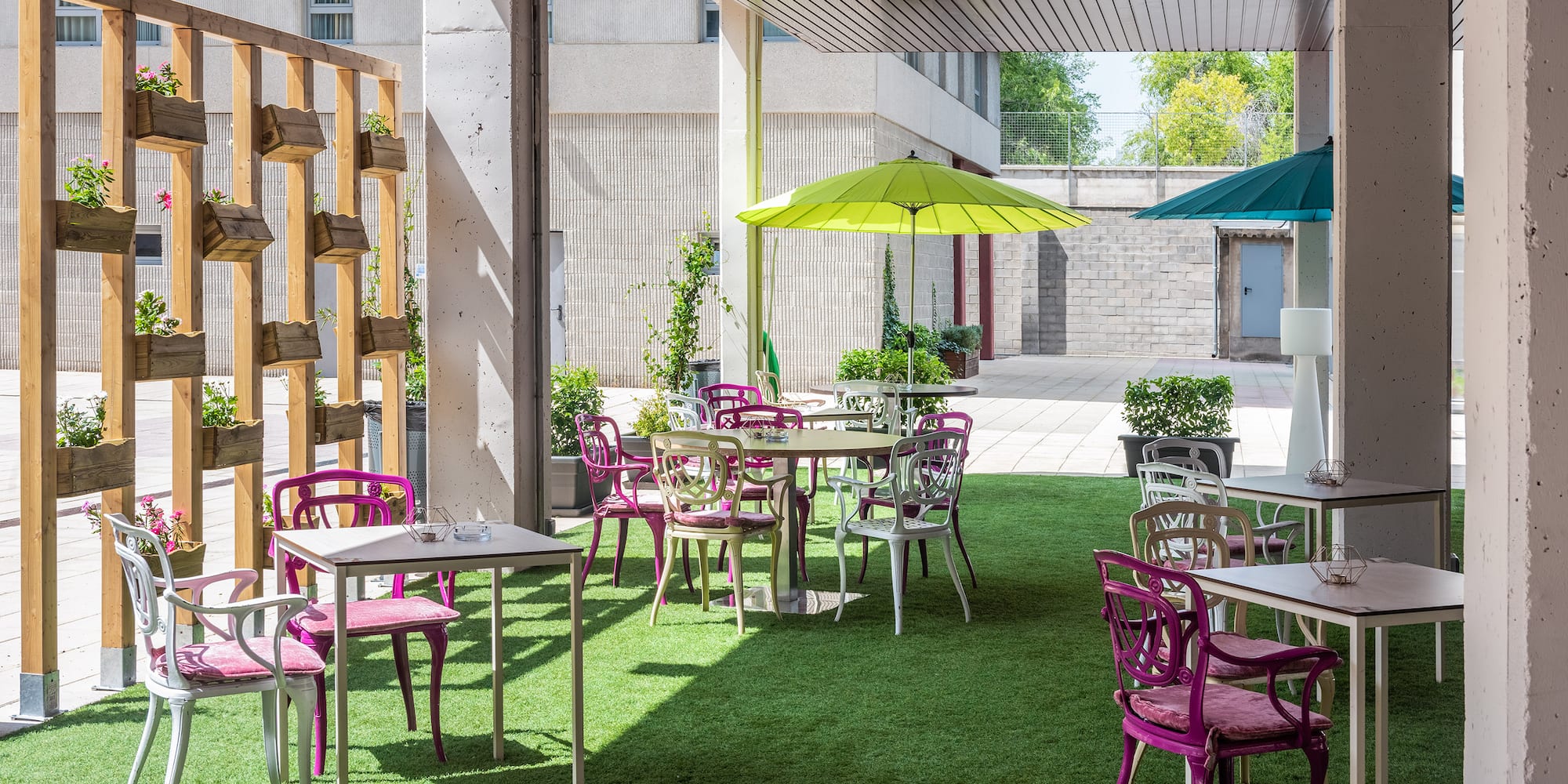 a patio with tables and chairs