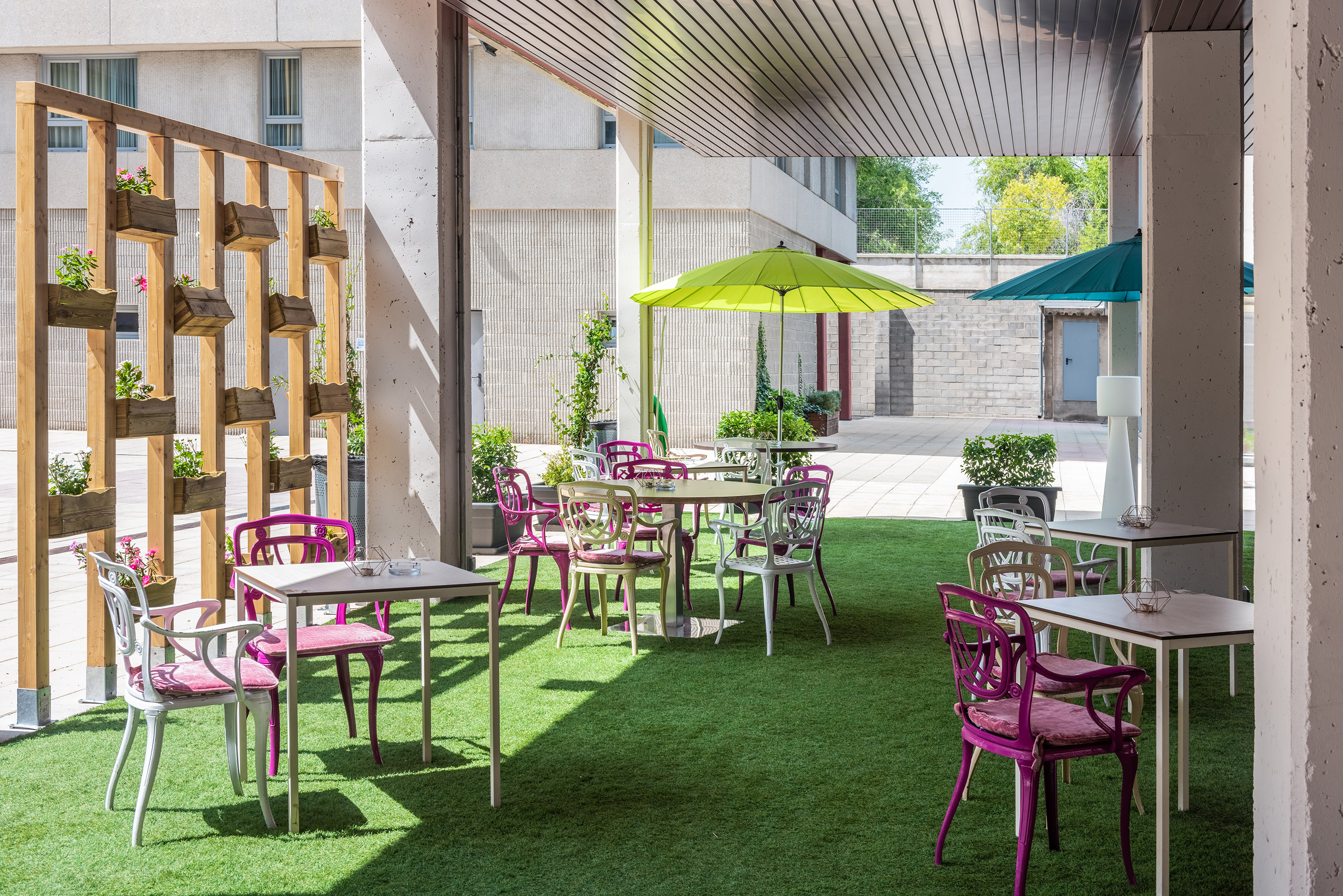 a patio with tables and chairs