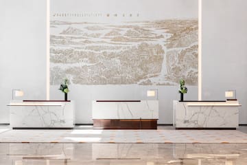 a white and gold reception desks