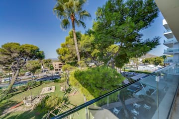 a view of a park from a balcony