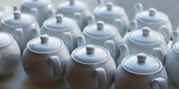 a group of white teapots